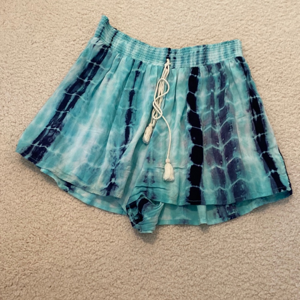 Perfect for summer with white or black top. Flowy, and soft with white strings.